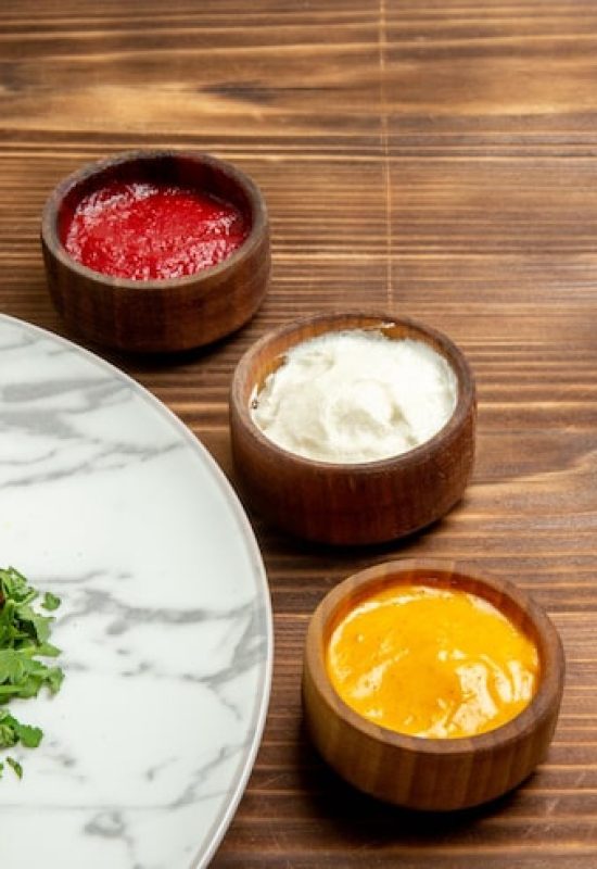 front-view-tasty-meat-slices-with-mushed-potatoes-seasonings-brown-desk-dish-meat-potato-meal-bread-food_140725-95400